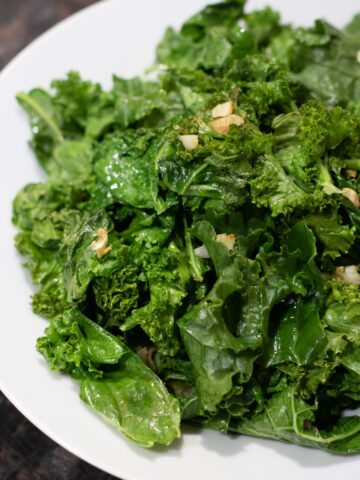 cooked garlic kale in a bowl.