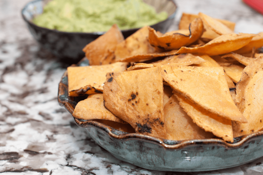 a bowl of fresh made corn tortilla chips.