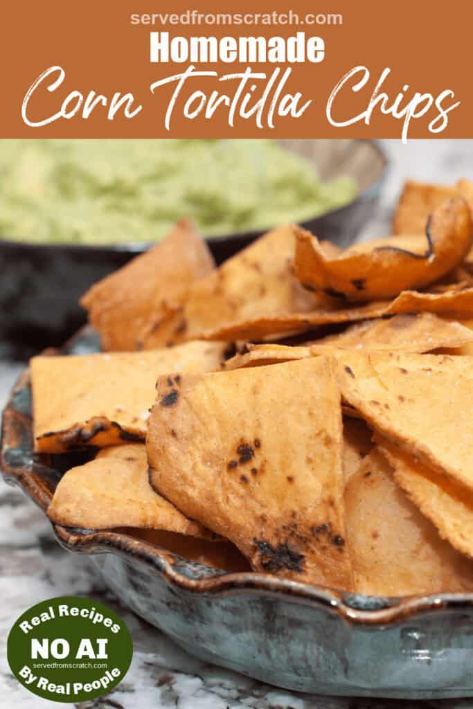 a plate of homemade fried tortilla chips with Pinterest pin text and a NO AI sticker.