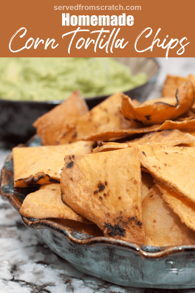 a bowl of fresh fried corn tortilla chips with Pinterest pin text.