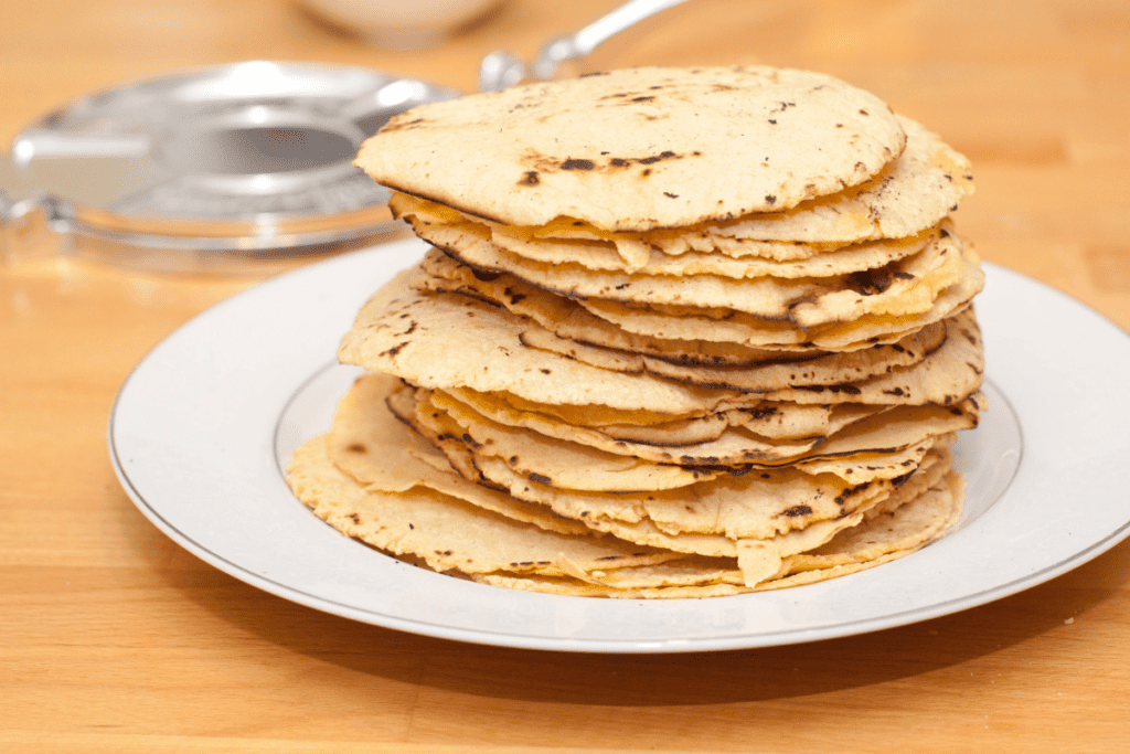 a stack of homemade corn tortilla chips.