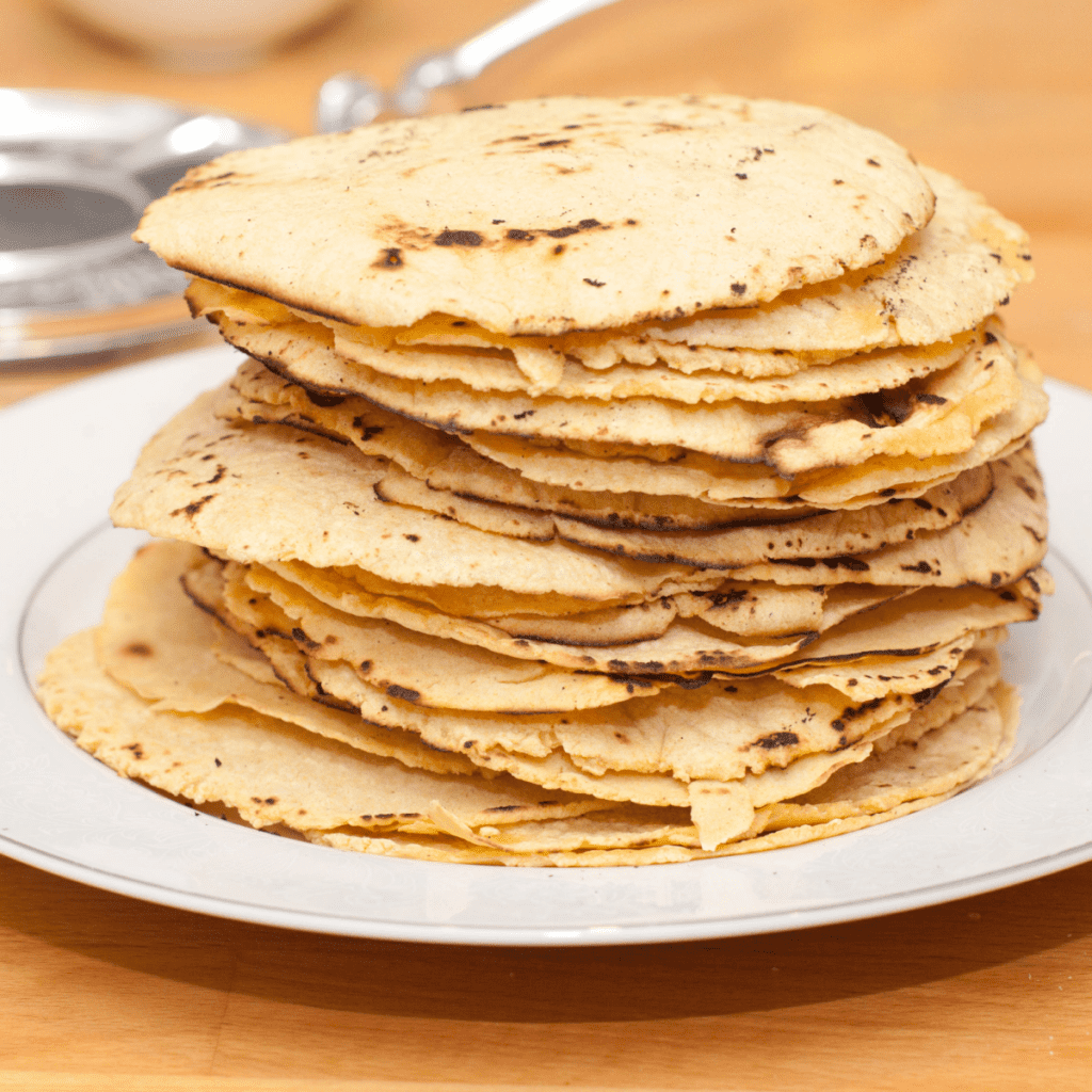 a stack of homemade corn tortilla chips.