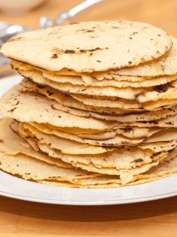 a stack of homemade corn tortilla chips.