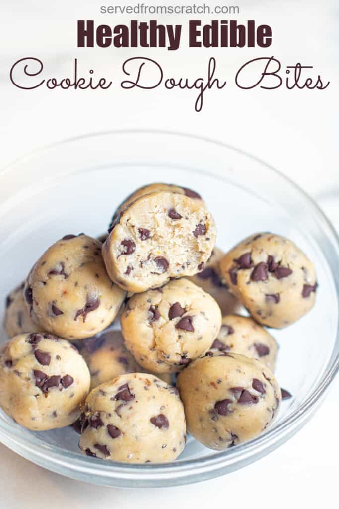 a bowl of cookie dough balls with one with a bite taken out with Pinterest pin text.