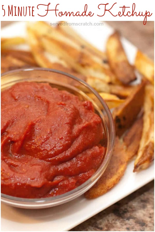 a bowl of ketchup on a plate of fries with Pinterest pin text.