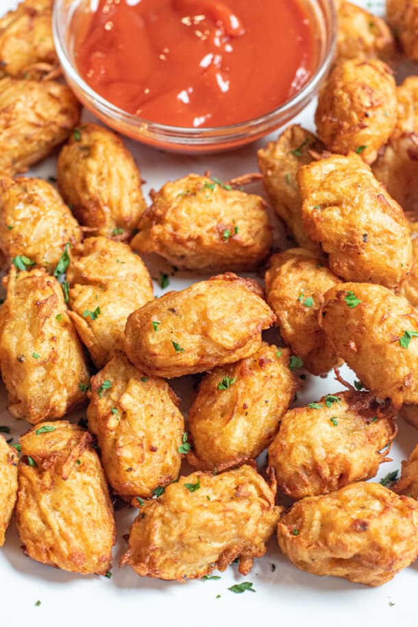 Crispy, fluffy tater tots with secret spices and dipping sauces.