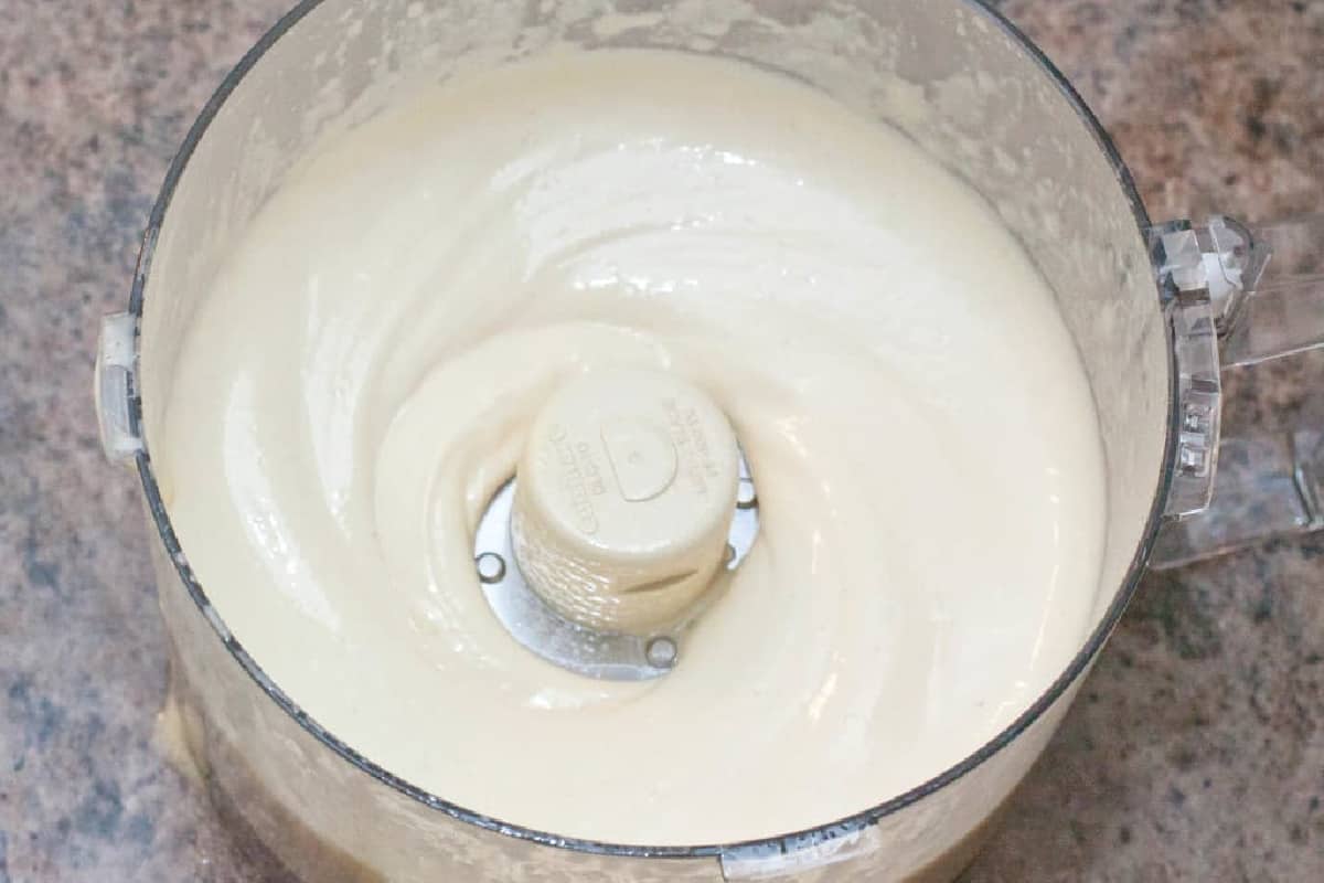 an overhead of a food processor with mayo.