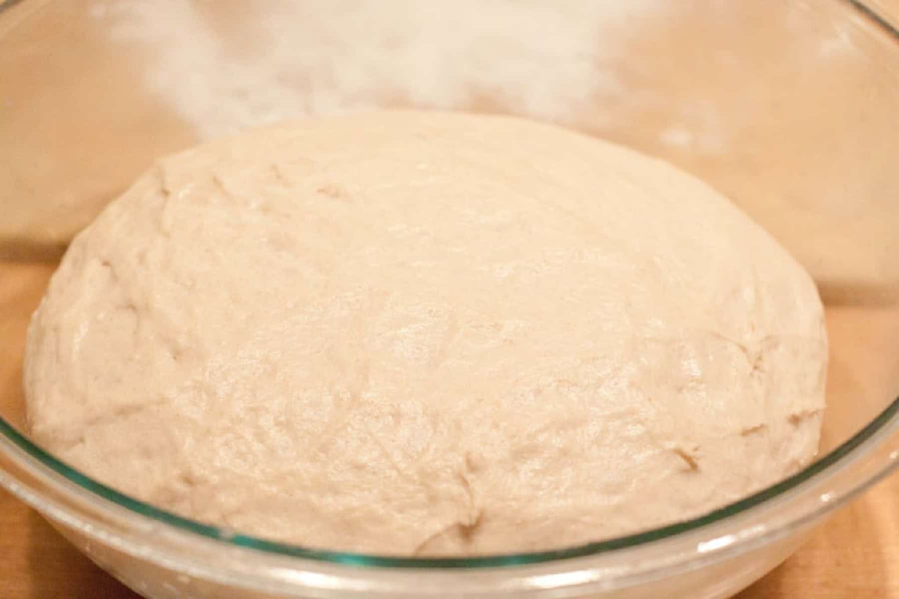 a risen dough in a bowl.