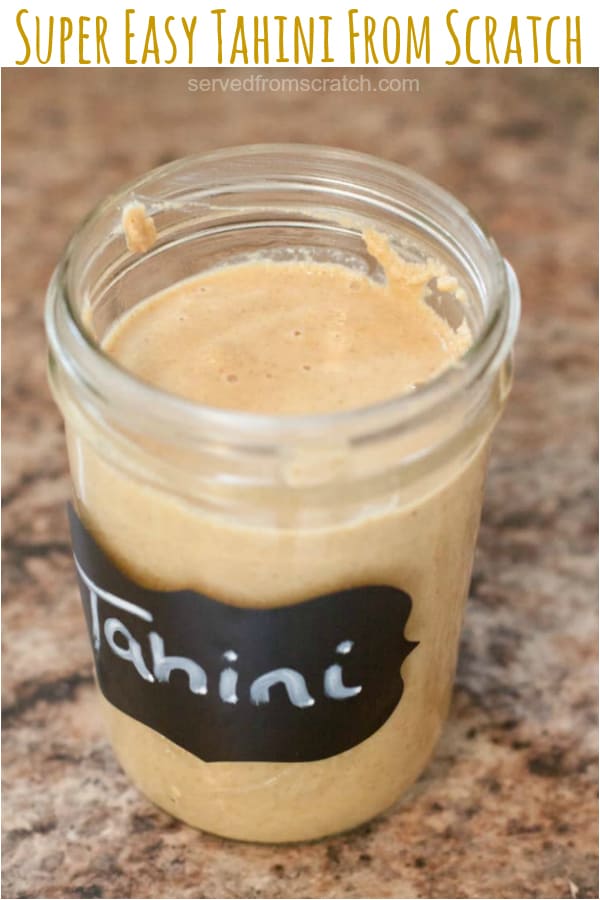 homemade tahini in a mason jar with Pinterest pin text.