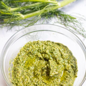 a bowl of pesto and fennel fronds.
