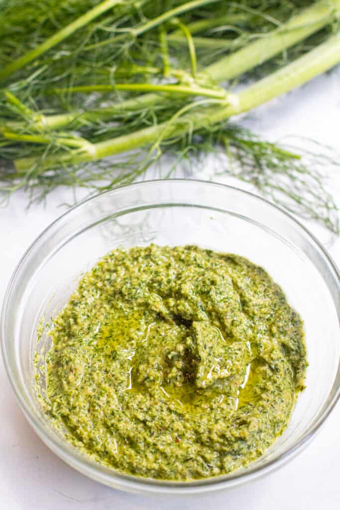 a bowl of pesto and fennel fronds.