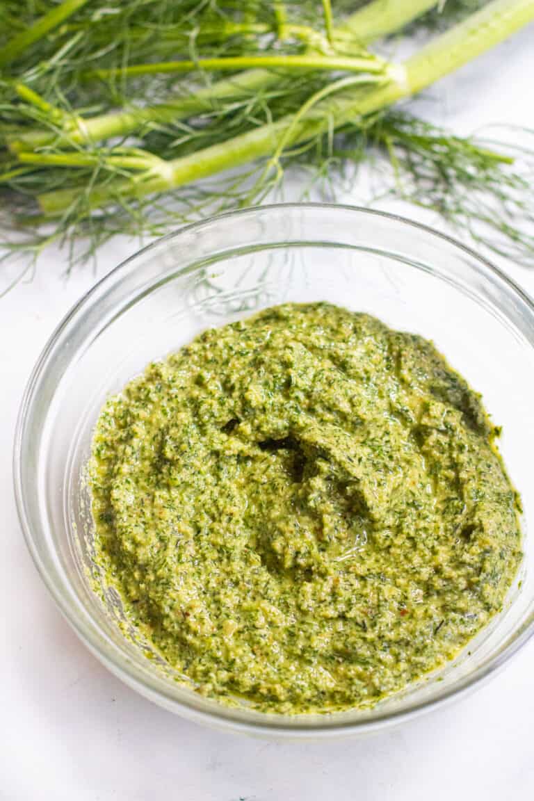 a bowl of pesto and fennel fronds.