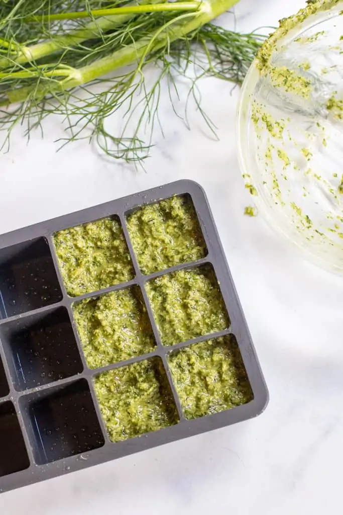 pesto in a ice cube tray.