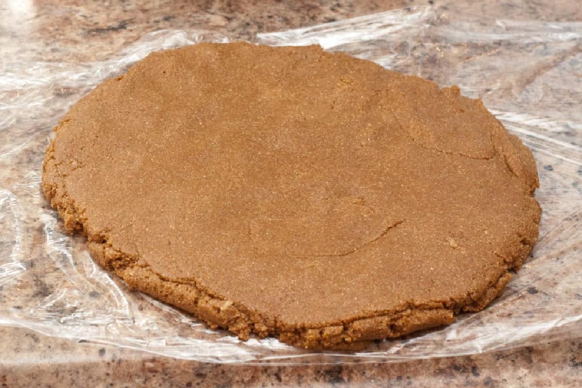 graham cracker dough rolled out in a disk.