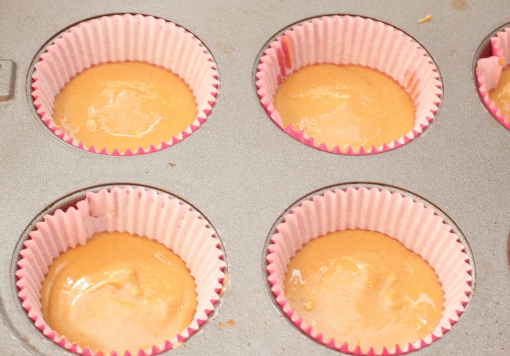 muffin tin with liners and peanut butter