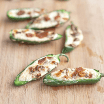 jalapenos halved and stuffed with cream cheese and crumbled bacon