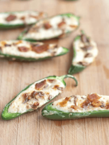 jalapenos halved and stuffed with cream cheese and crumbled bacon