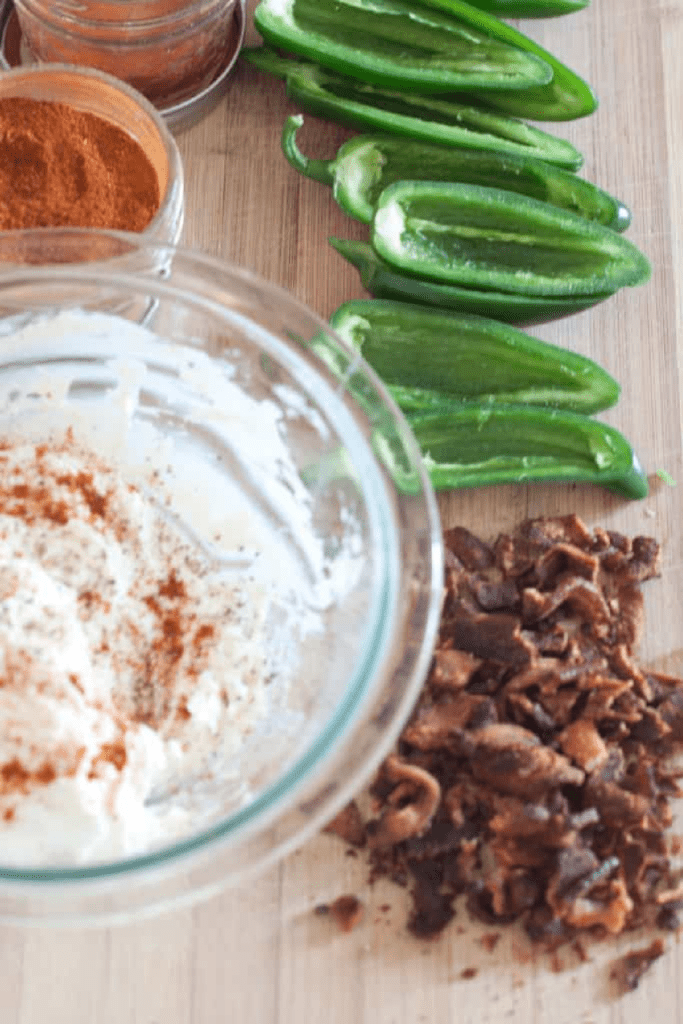 jalapenos, bacon, and a bowl of whipped cheese and spices.