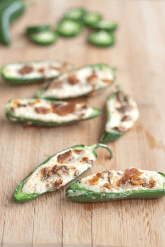 jalapenos halved and stuffed with cream cheese and crumbled bacon