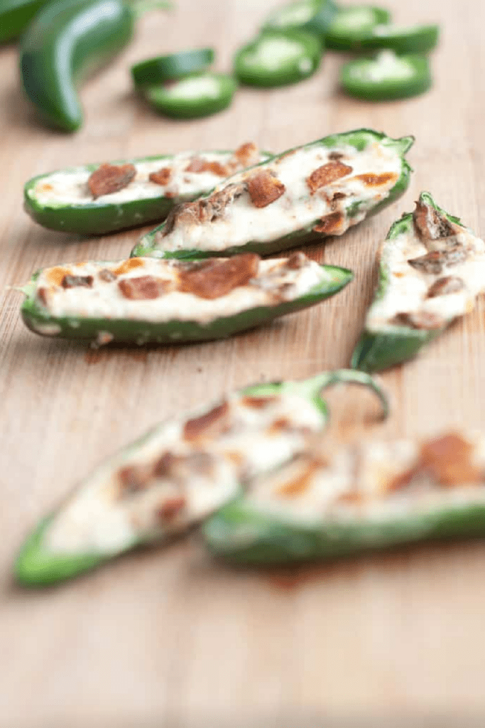 jalapenos halved and stuffed with cream cheese and crumbled bacon