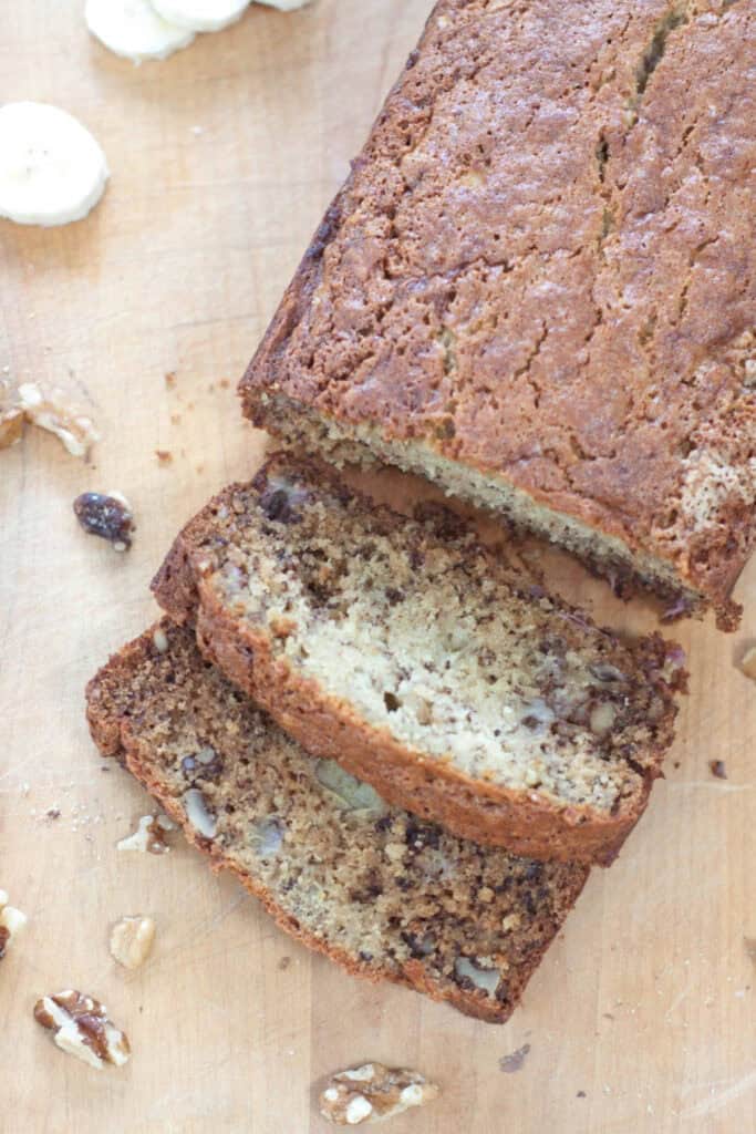 an overhead of loaf of banana bread sliced.