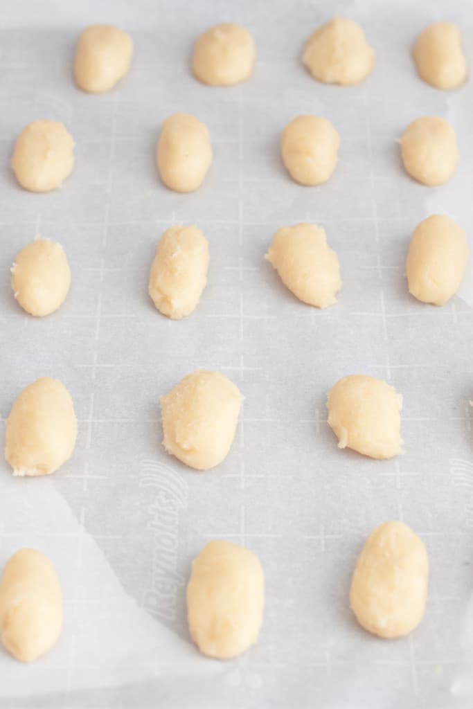 unbaked cookie dough on baking sheet