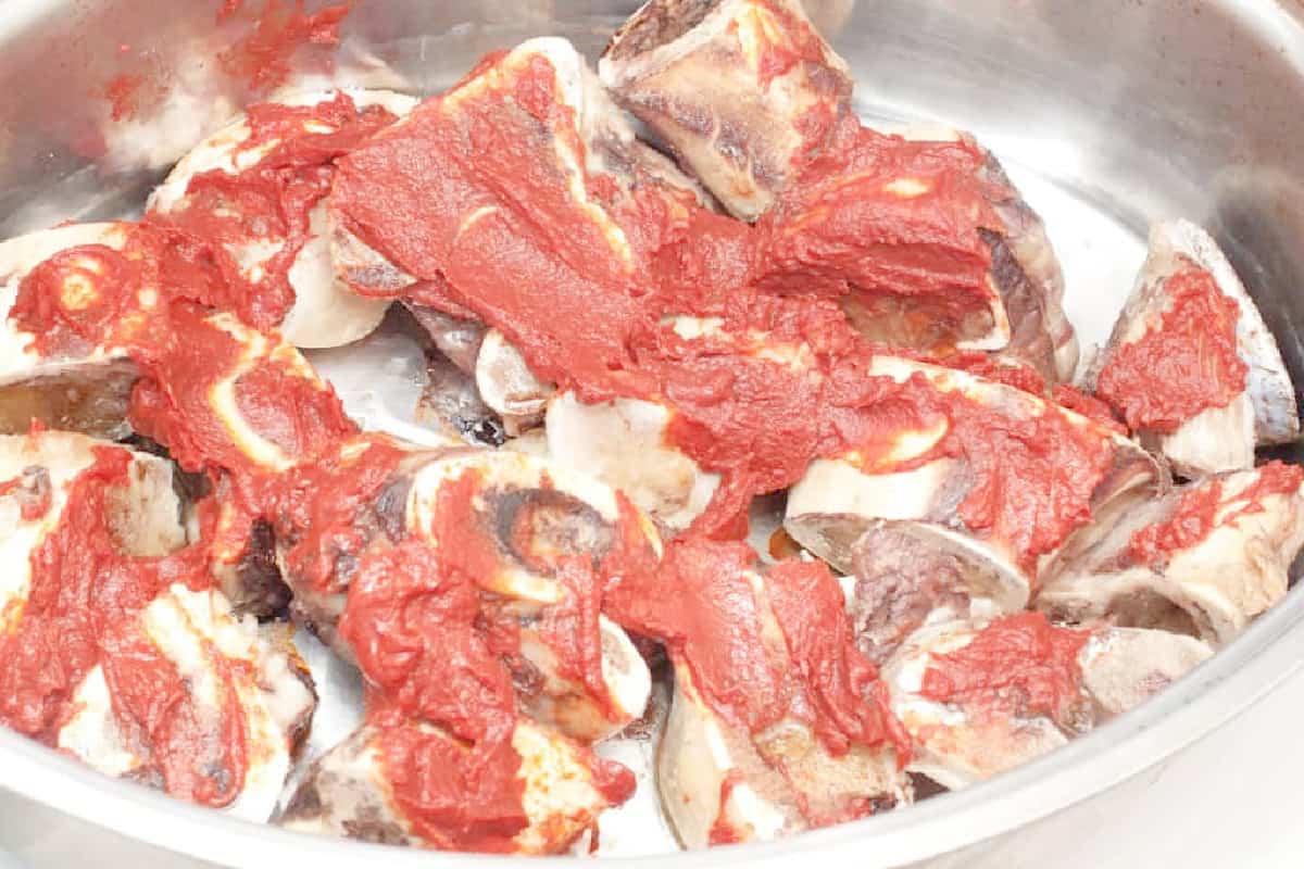 beef bones covered with tomato paste.