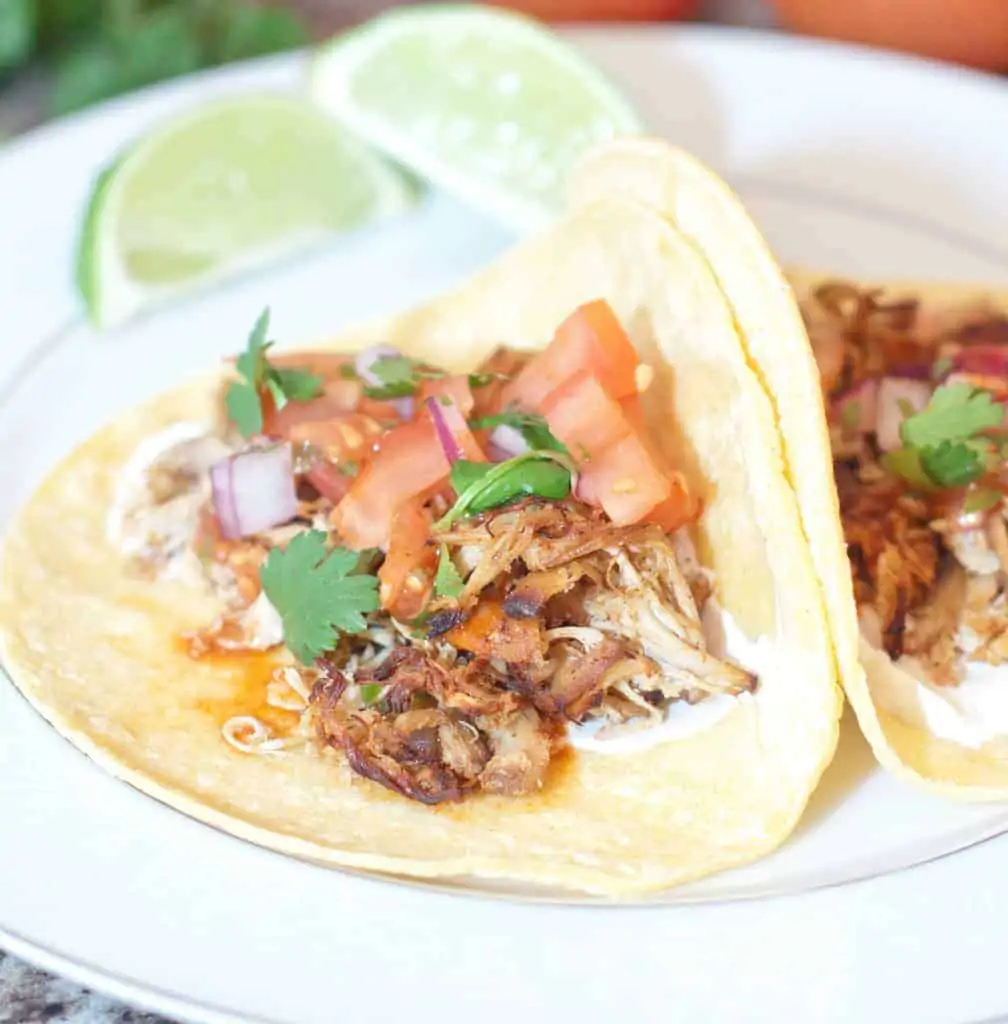 chicken tacos on a plate.