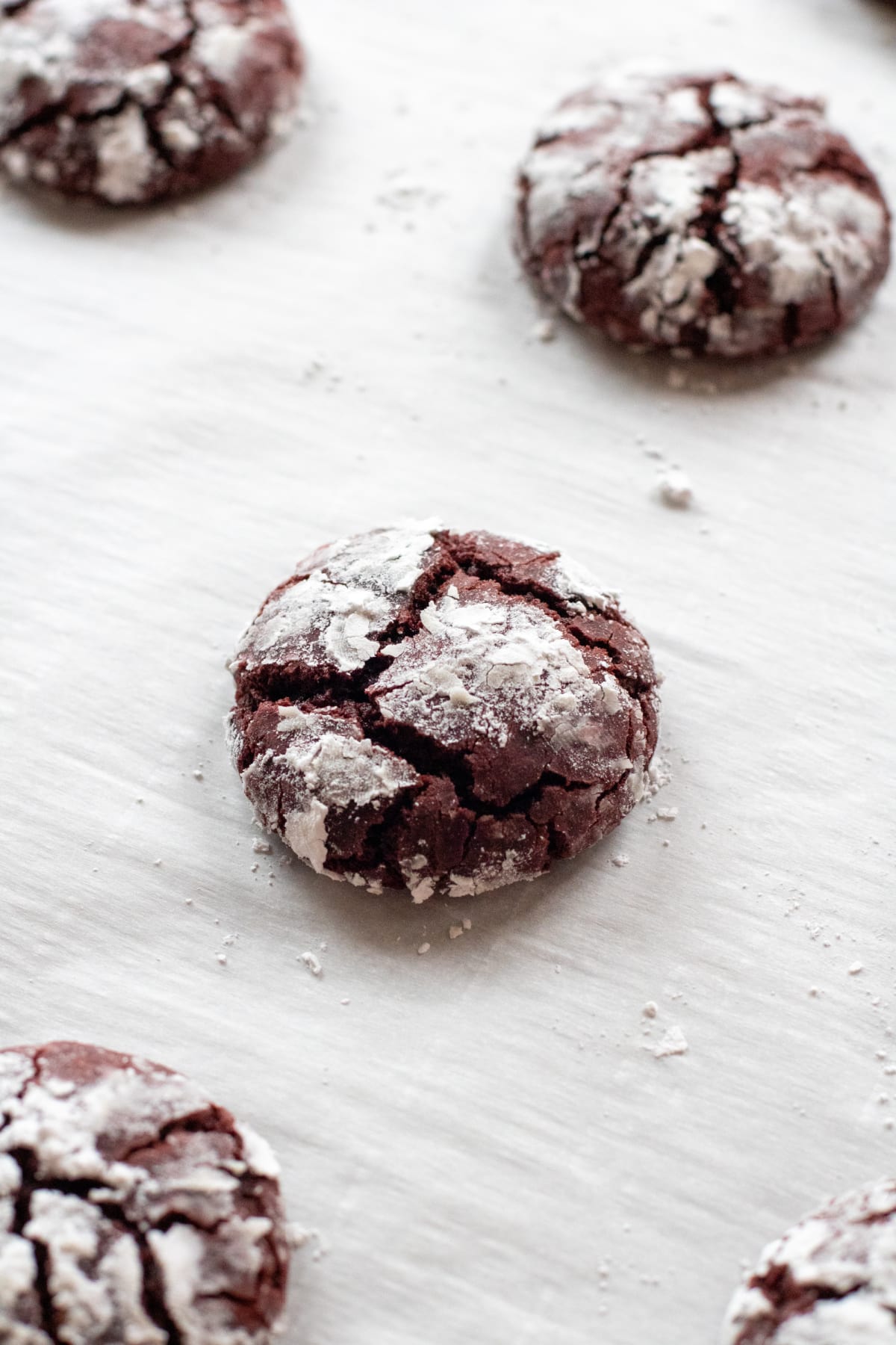baked red velvet  cookies on parchment paper. 