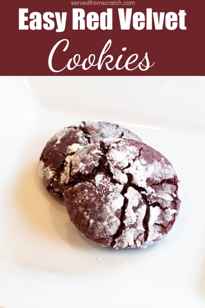 A plate with two red velvet cookies with a sugar coating with Pinterest pin text.