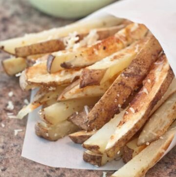 steak fries with cheese and an aioli