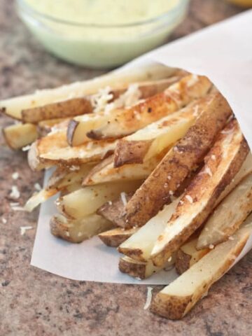 steak fries with cheese and an aioli