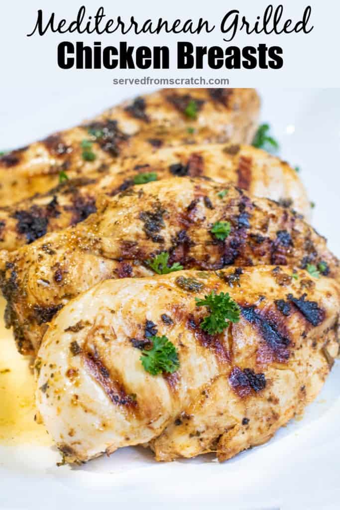 a plate of grilled chicken breasts with Pinterest pin text.