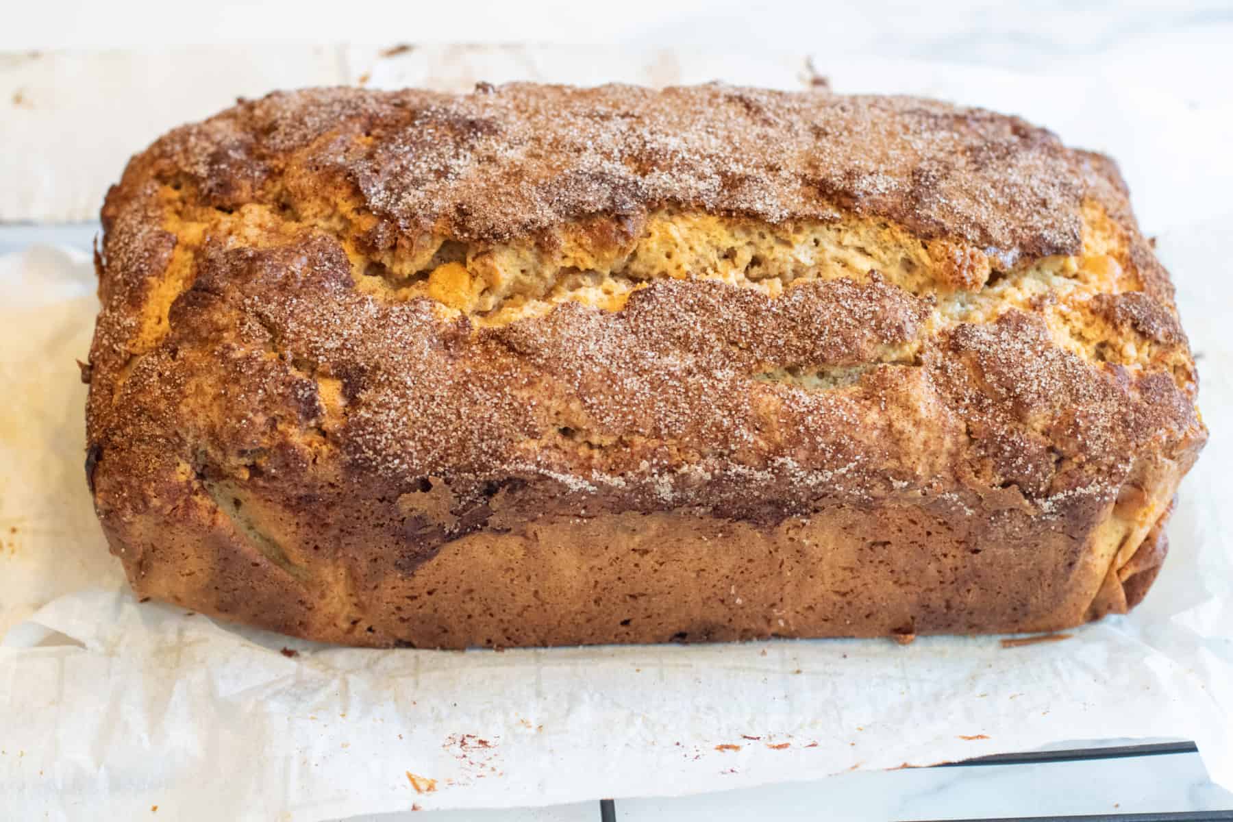 a baked loaf covered with cinnamon and sugar.