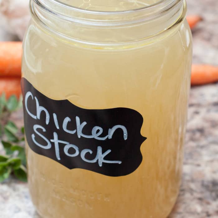 a large mason jar of chicken stock