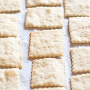 baked saltine crackers on parchment paper.