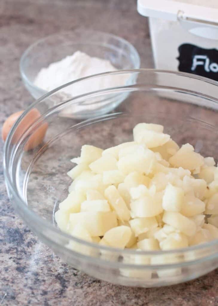 a bowl of cooked mashed potatoes.