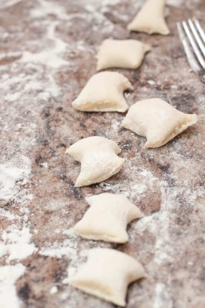a line of homemade uncooked gnocchi.