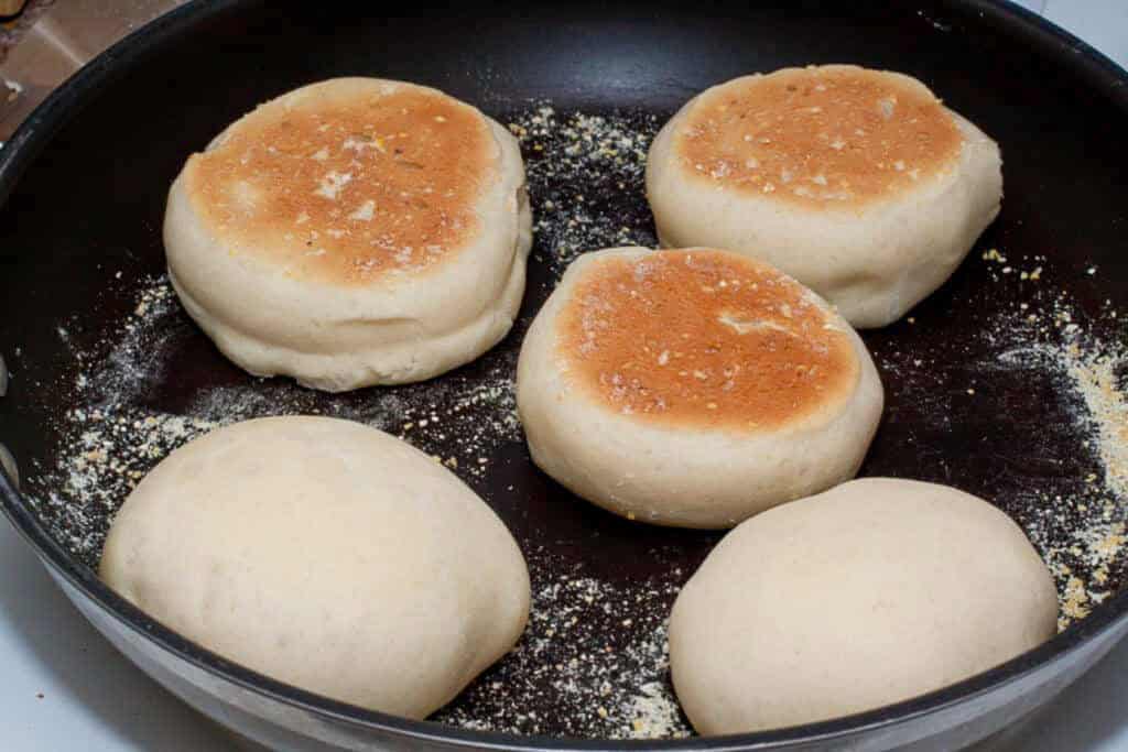 browned and english muffins in a pan.