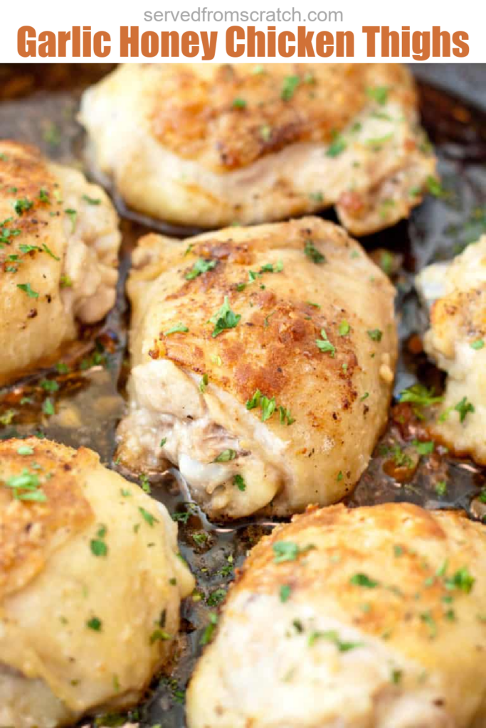 skin on baked chicken thighs in a pan.