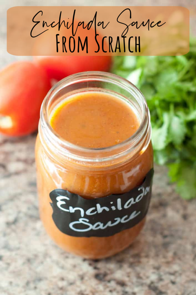 an open jar of enchilada sauce and pinterest pin text.