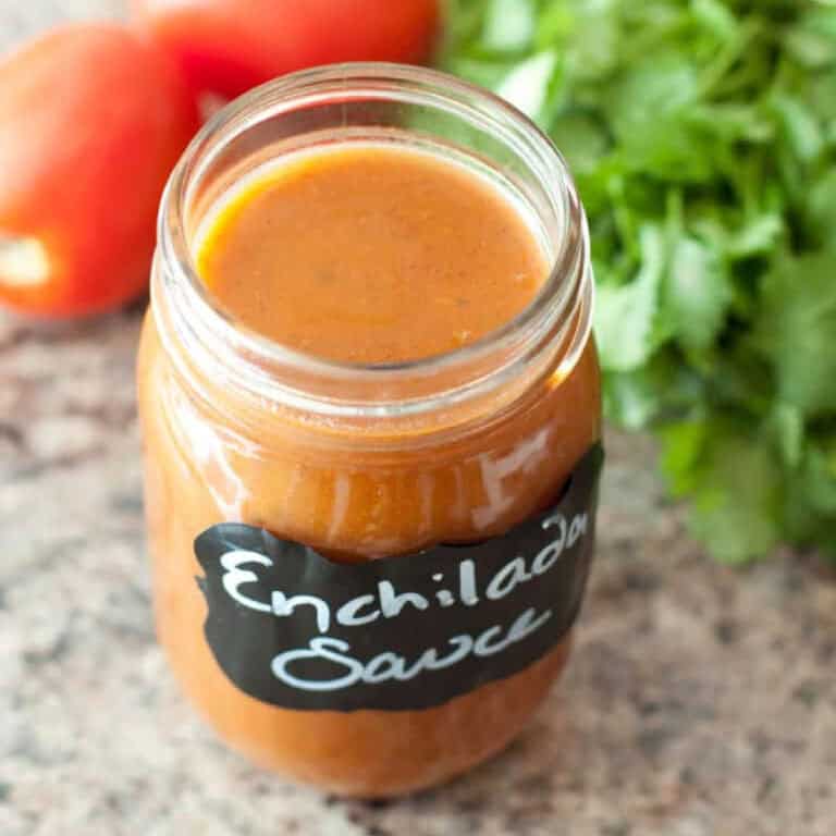 an open labeled jar of enchilada sauce.