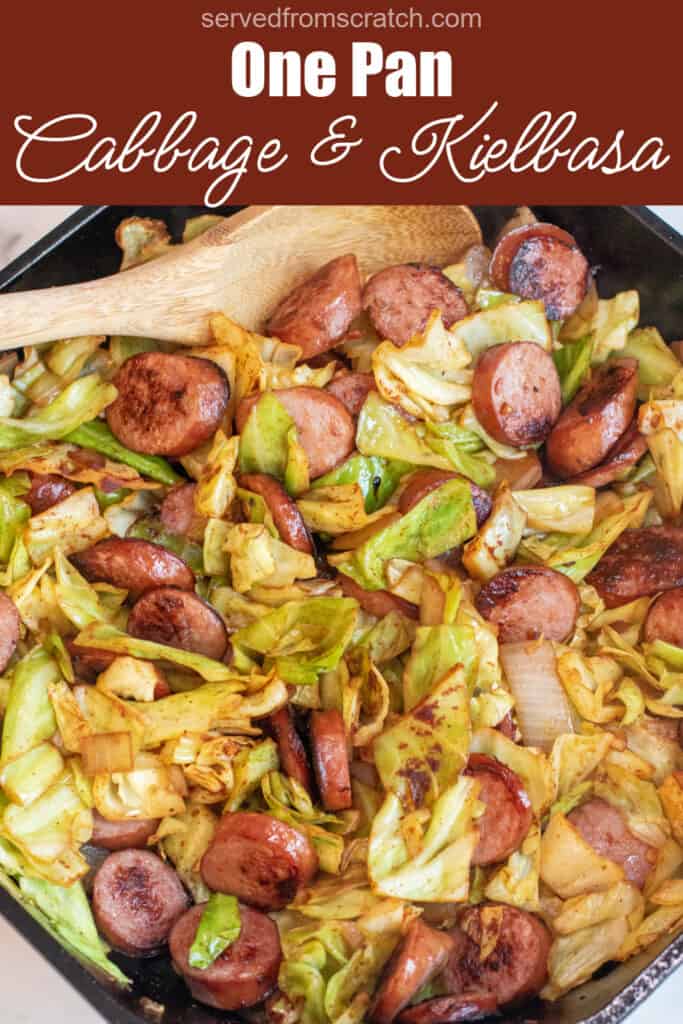overhead of large pan with cooked kielbasa and cabbage with Pinterest pin text.