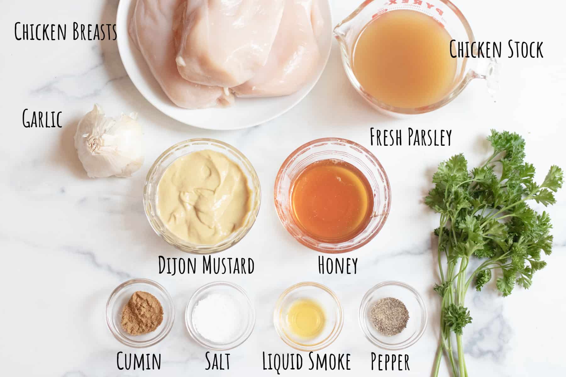 chicken, garlic, stock, parsley, mustard, honey, spices in bowls.