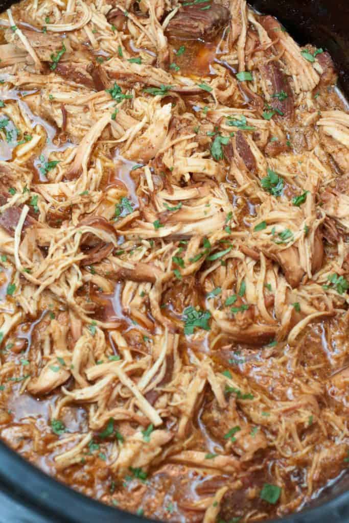 cooked shredded chicken in a crock pot