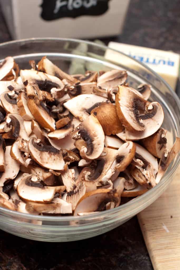 a large bowl of sliced mushrooms.