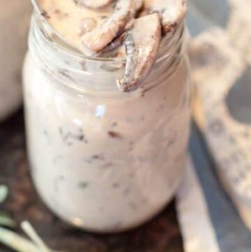 a jar of cream of mushroom soup with a spoon