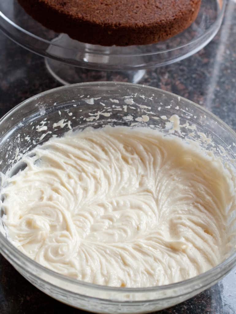 a bowl of whipped  cream cheese frosting.