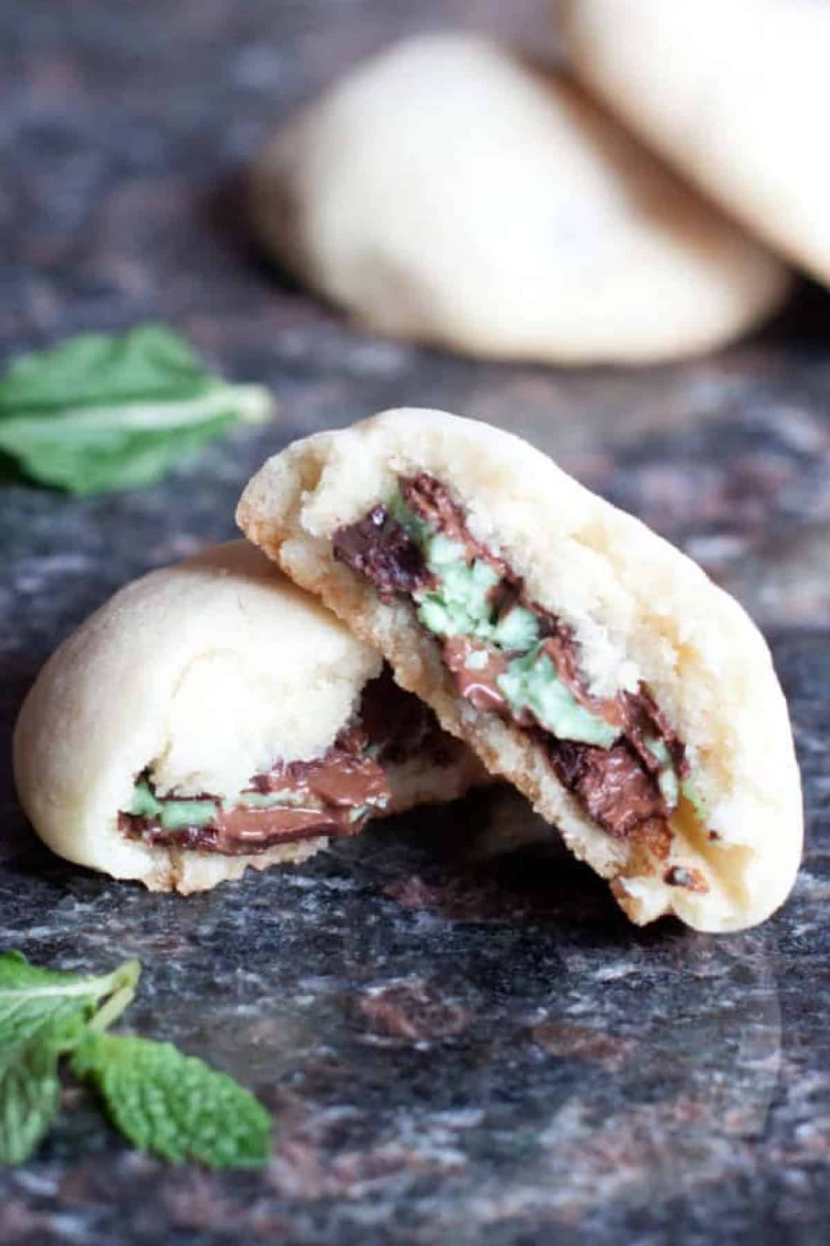 a halved cookie stacked with an andes mints on the inside.