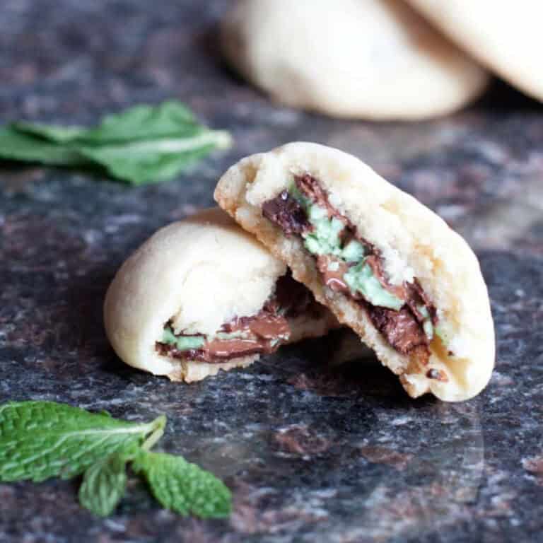 a halved cookie stacked with an andes mints on the inside.